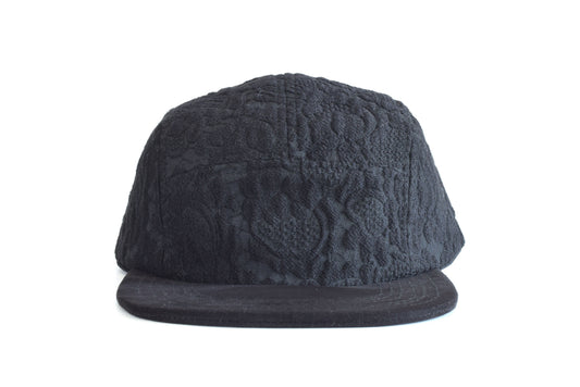 Dark gray textured cap on a white background